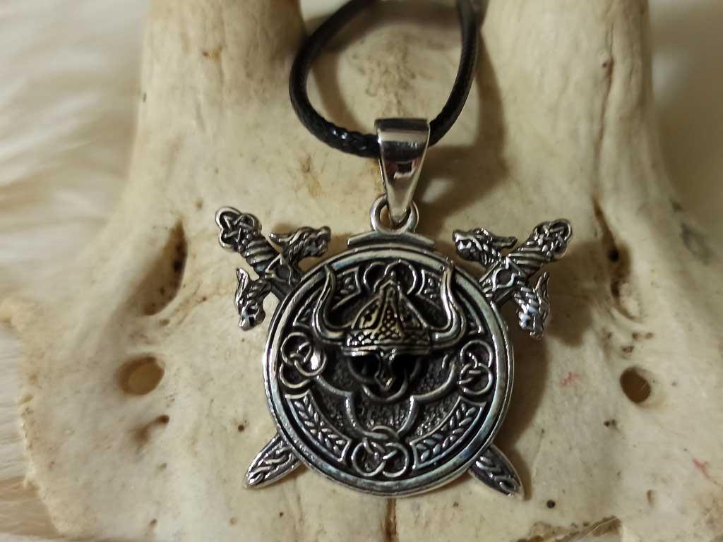 Viking helmet in the rune circle